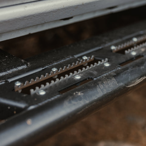 Close up quartering side view of the serrated teeth of the step inserts for the C4 Sliders for 2024+ Tacomas.