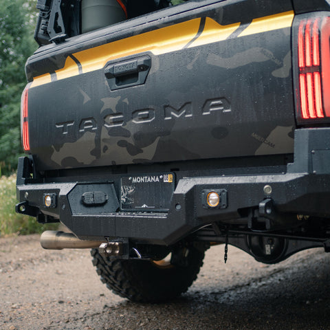 Close-up showing the bolt-together design of the C4 Overland rear bumper for the 2024+ Tacoma.