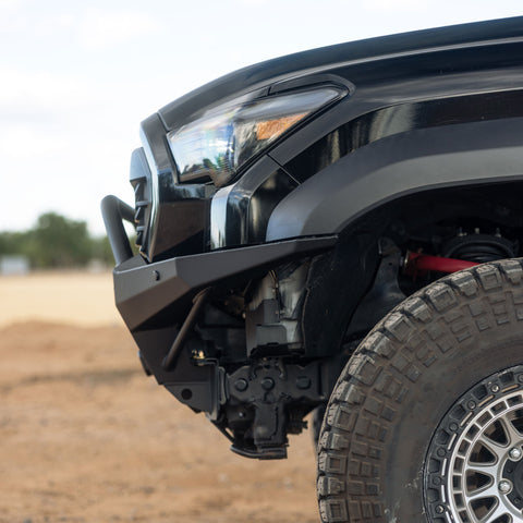 Side profile view of installed Tacoma Rock Runner Front Bumper with plate sides and low bar