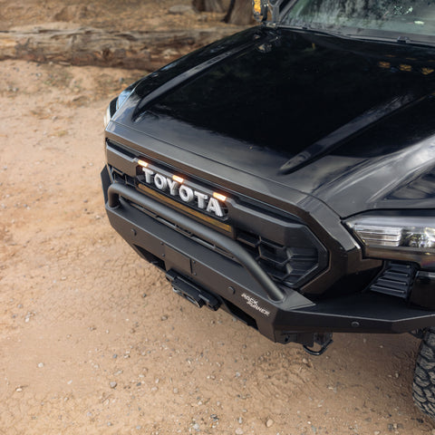 High-angle view of installed 4th gen Tacoma Rock Runner Front Bumper with plate sides and low bar option