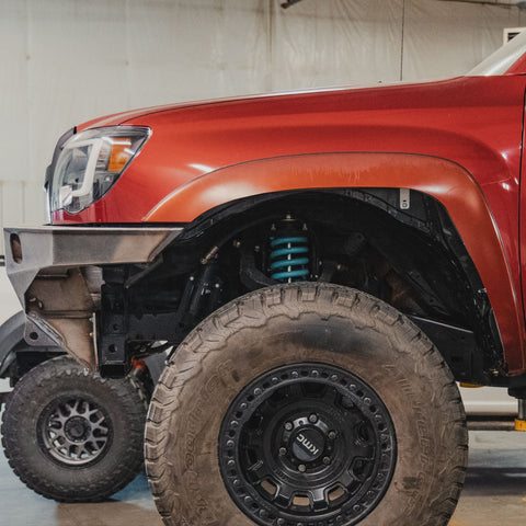 Side view of a trimmed front fender flare after installation of the C4 HCFL kit.