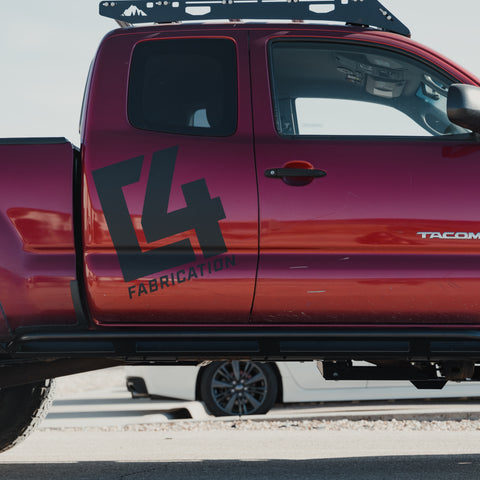 View from the side showing the rocker and front bed protection of the C4 Rock Runner sliders.