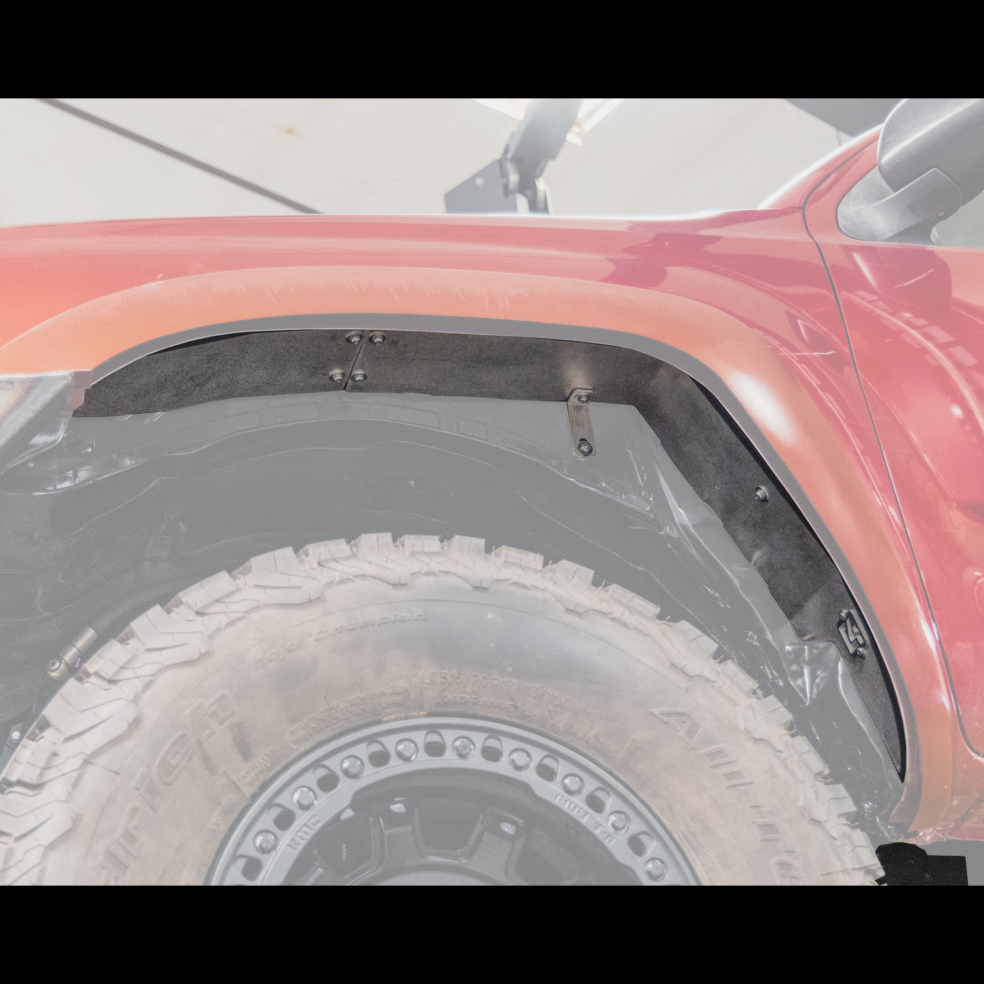 Cover photo showing the Oversized Tire Fitment Kit installed on a Tacoma with everything but the kit components faded out.