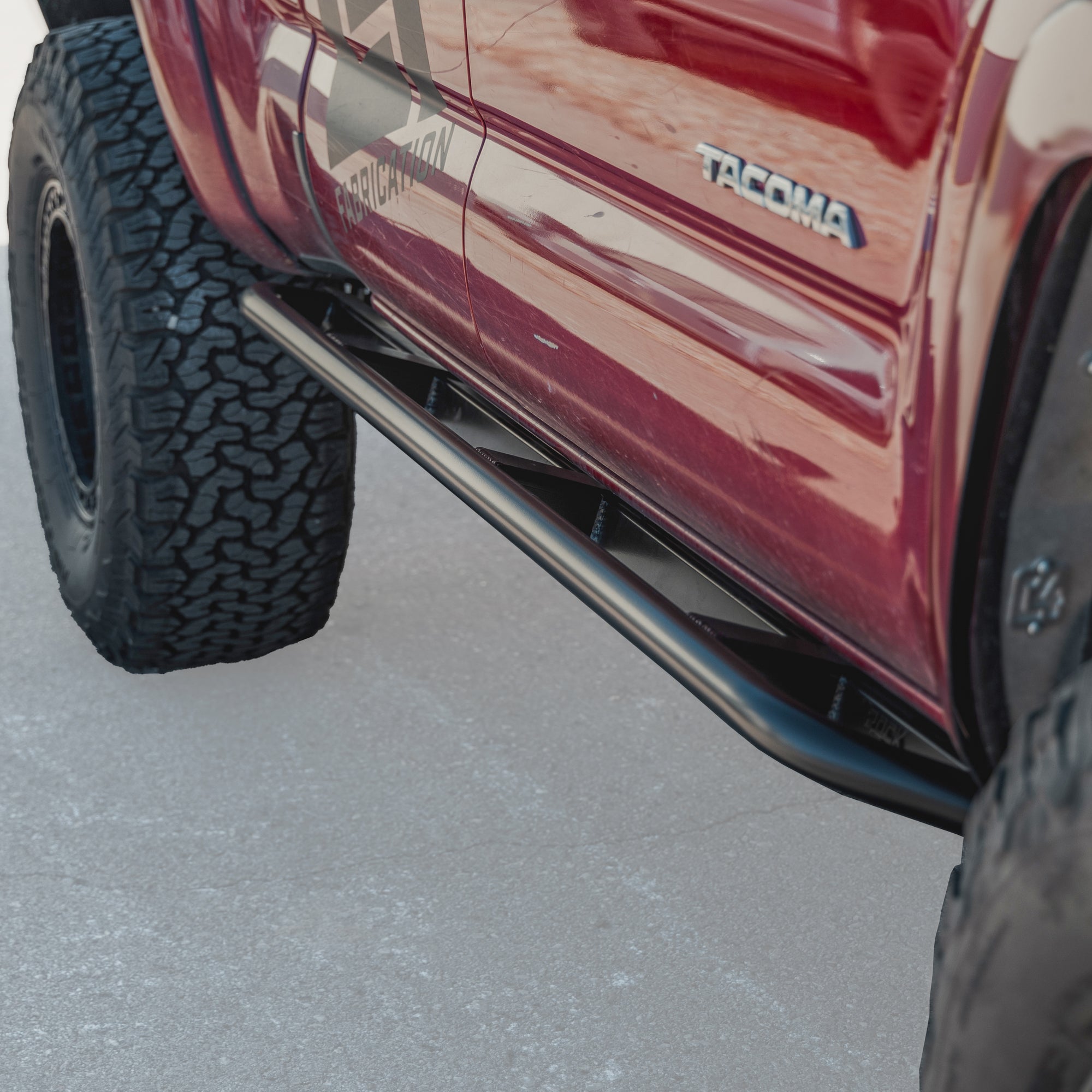 Cover photo of the C4 Rock Runner Sliders for the 2nd Gen Tacoma with the slider and truck emphasized and the background faded out. 