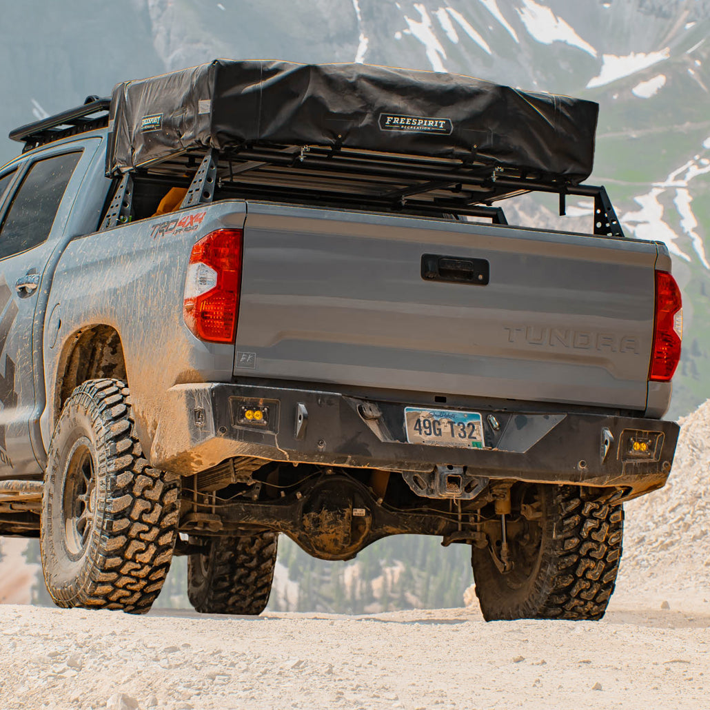 Cover photo of the C4 Overland rear bumper for the 2nd Generation Tundra with the background faded out and emphasis on the truck and its bumper.