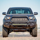 Cover photo for the C4 Lo-Pro front winch bumper for the 3rd Generation Toyota Tacoma with the background faded out and emphasis on the truck and its bumper.