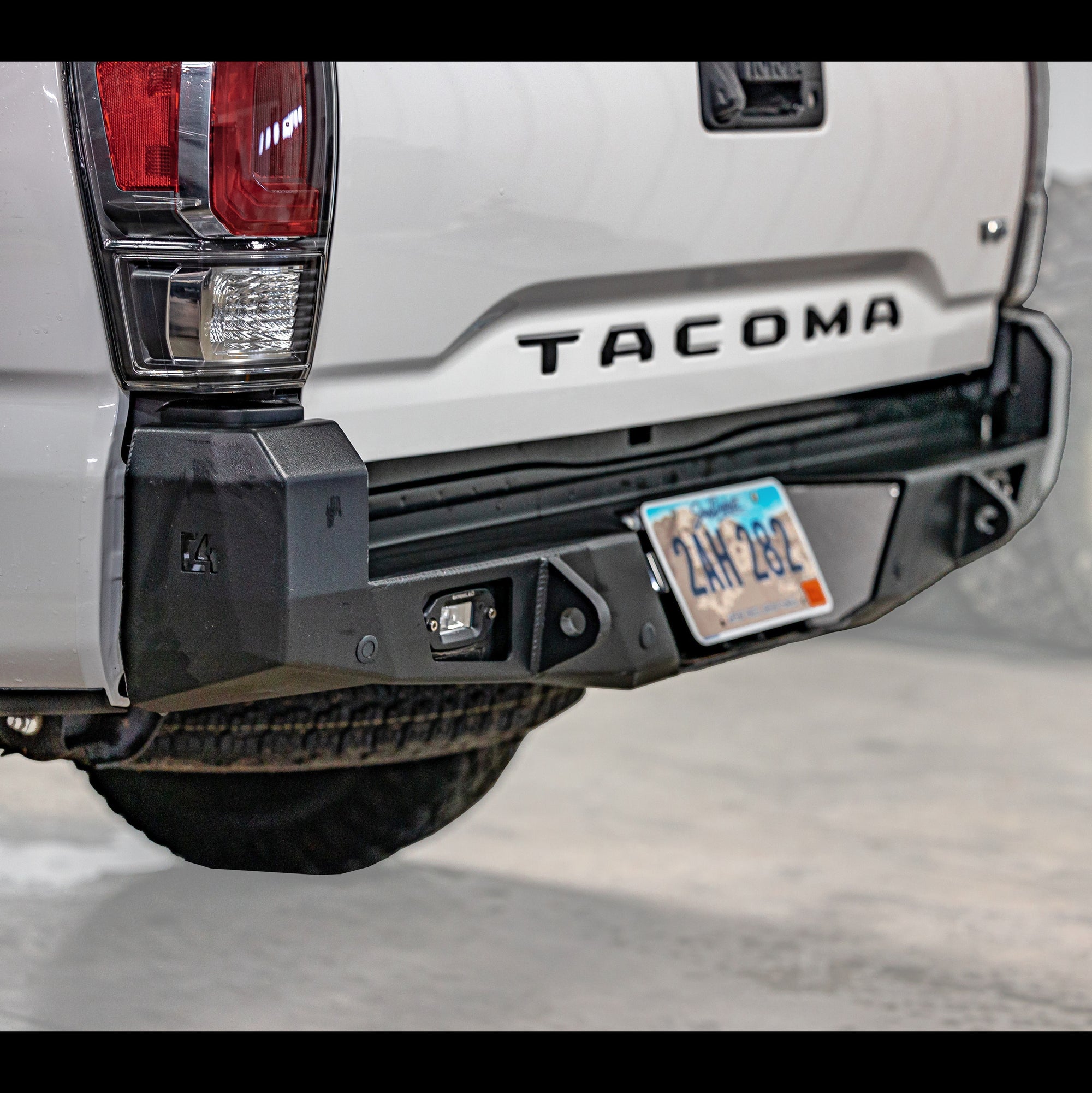 Cover photo for the C4 Overland Rear Bumper for 3rd Generation Toyota Tacomas with the background faded out and emphasis on the vehicle and its bumper.