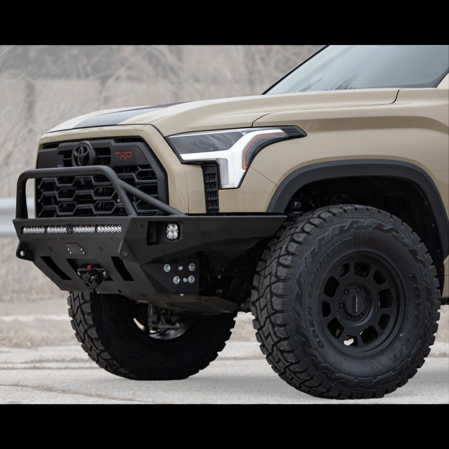 Cover photo for the C4 Overland front winch bumper for the 3rd Generation Tundra with the background faded out and emphasis on the bumper and Tundra.