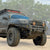 Cover photo of the C4 Overland front winch bumper for the 2003-2009 Toyota 4Runner with the background faded out and emphasis on the truck and its bumper.