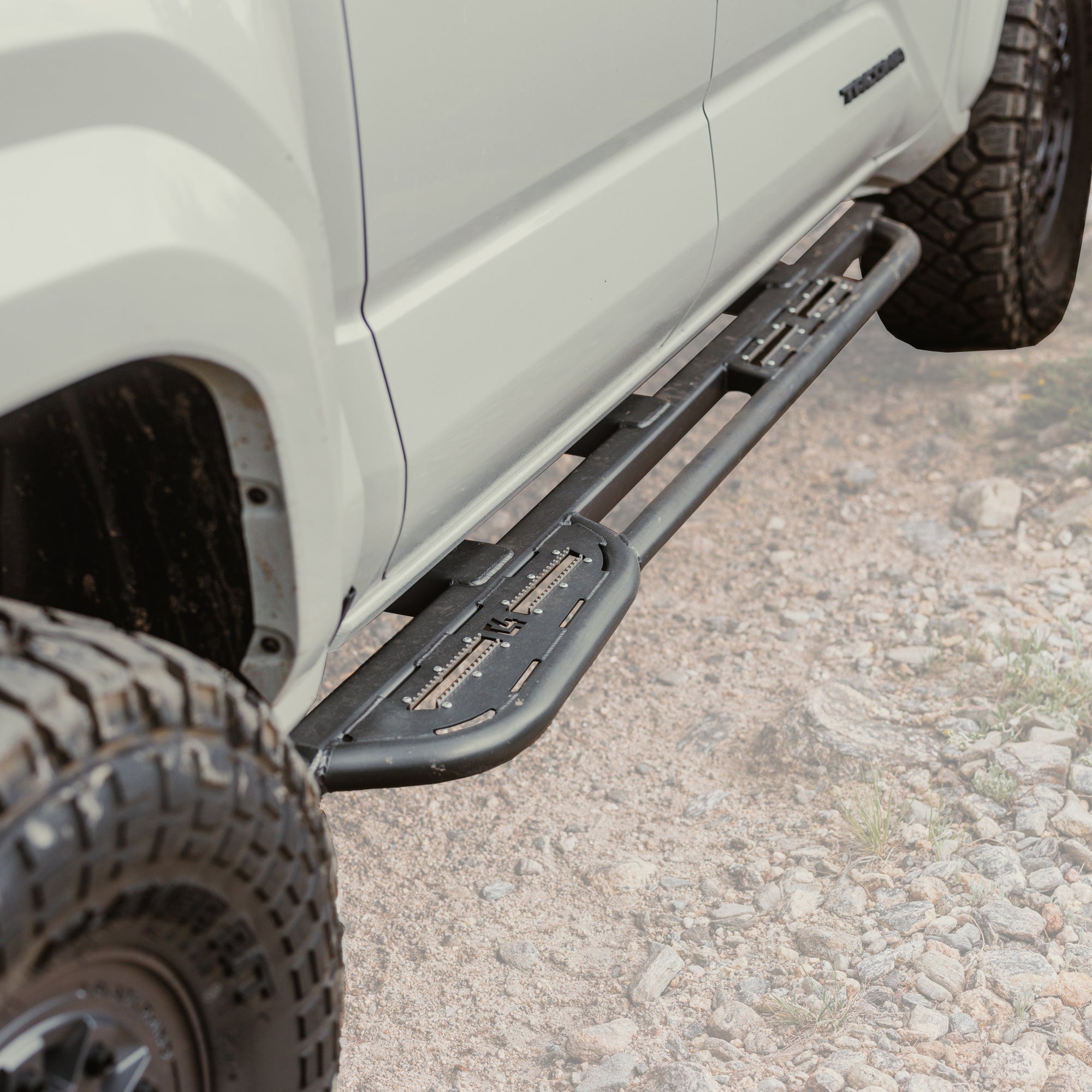 Feature photo of the C4 sliders for the 4th Generation Tacoma with the background faded out and the steel slider front and center. 