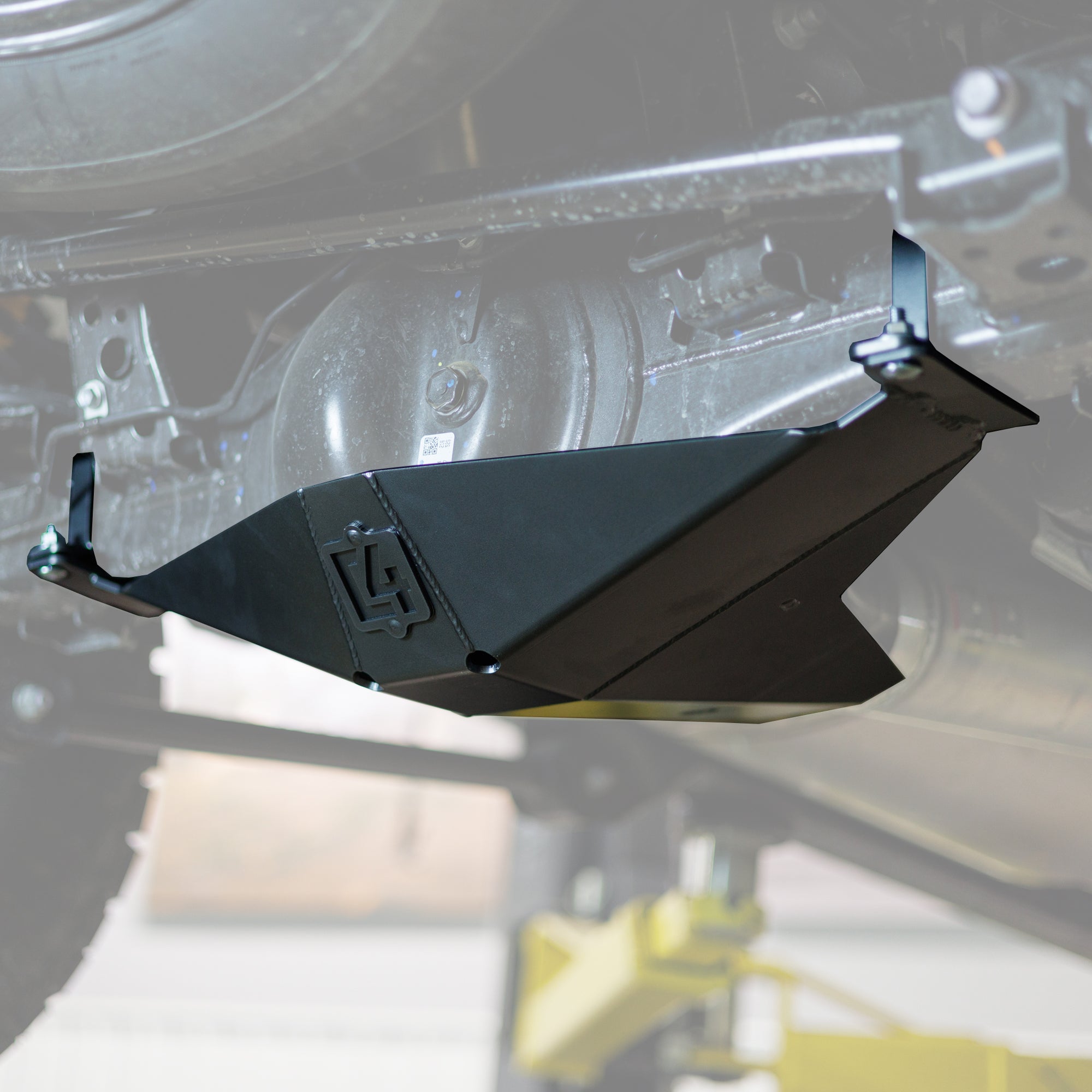 Cover photo of the C4 Rear Differential Skid Plate for the 4th Gen Tacoma with the background faded out and emphasis on the skid.