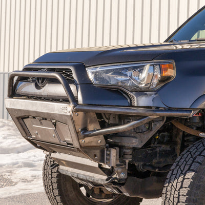 Quartering on driver's side view of the C4 Rock Runner bumper for the 2010-2024 Toyota 4Runner with the background faded out and emphasis on the bumper and truck.