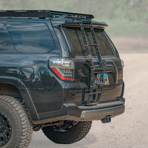 Cover photo of the C4 Summit Hatch Ladder with the background faded out and emphasis on the 4Runner and the ladder. 