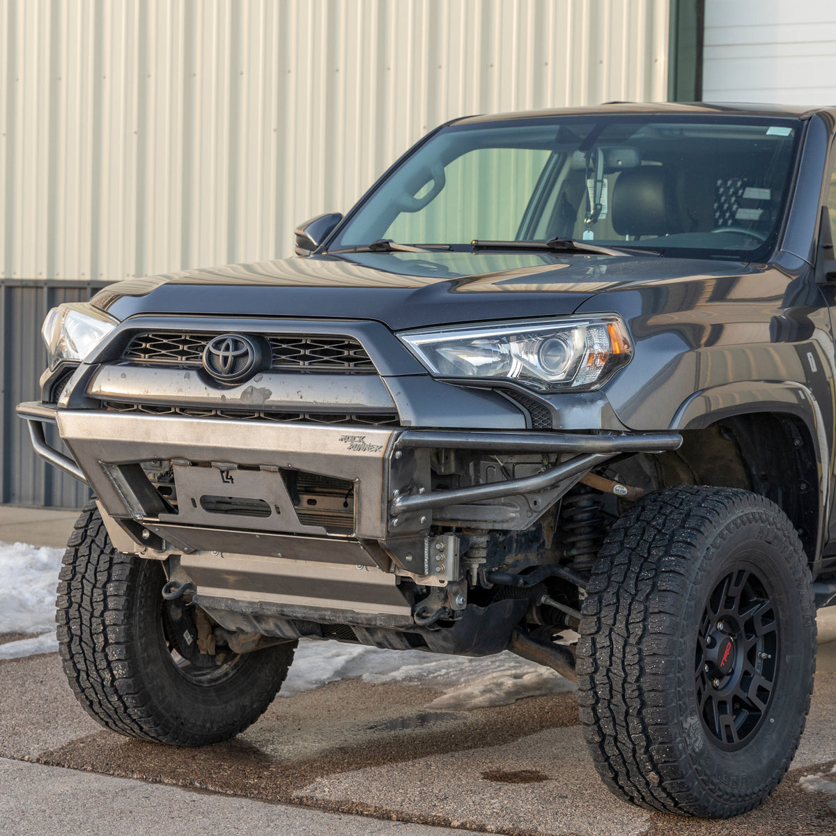 Angled view from driver's side of the C4 Rock Runner winch bumper for the 5th Gen 4Runner shown with tube sides and no bull bar.