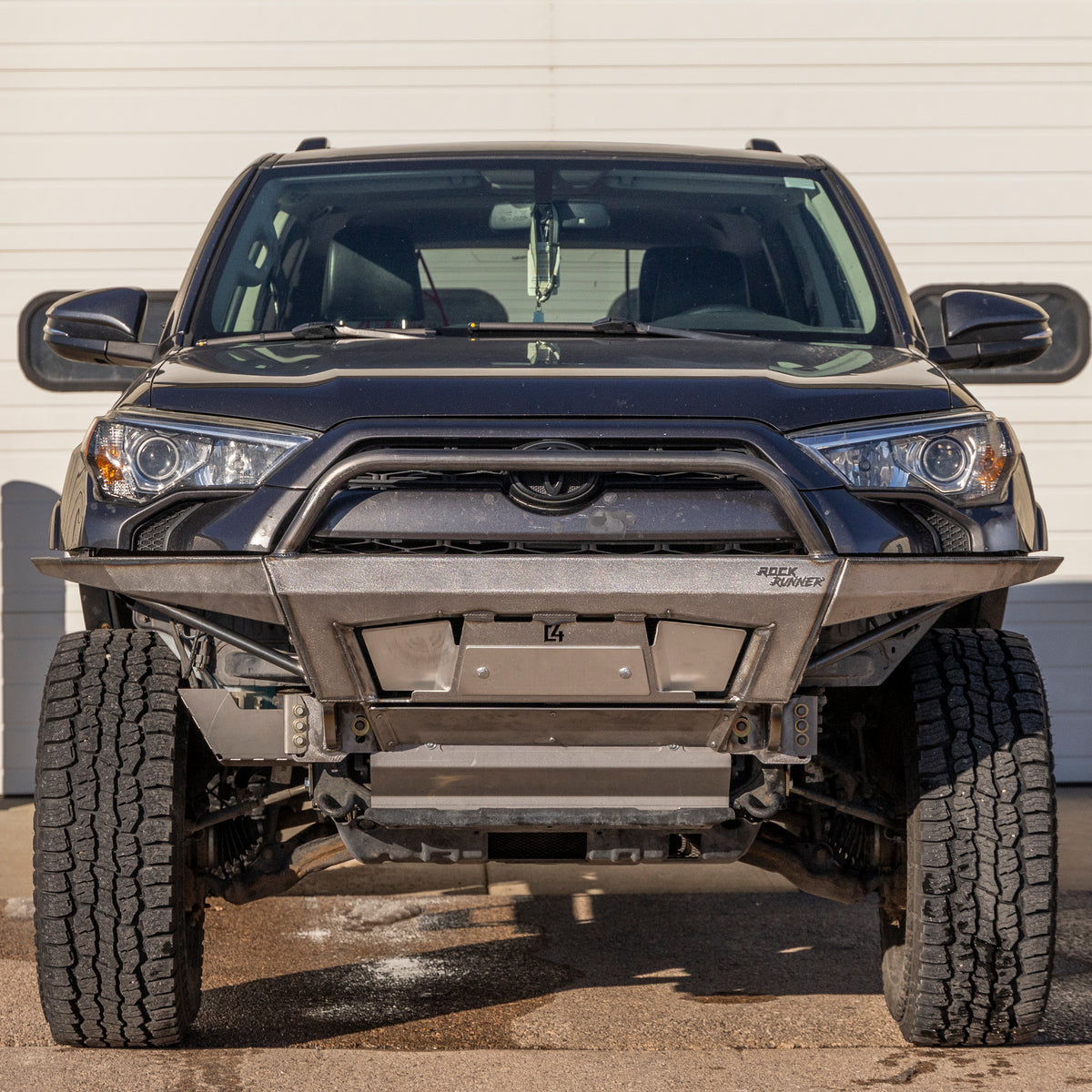 Front view of the Rock Runner winch bumper for the 5th Gen T4R in plate sides with mid-height bull bar configuration.