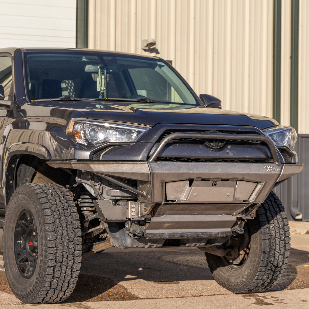 Passenger front view of a grey 4Runner with the C4 Rock Runner bumper with bull bar and plate sides.