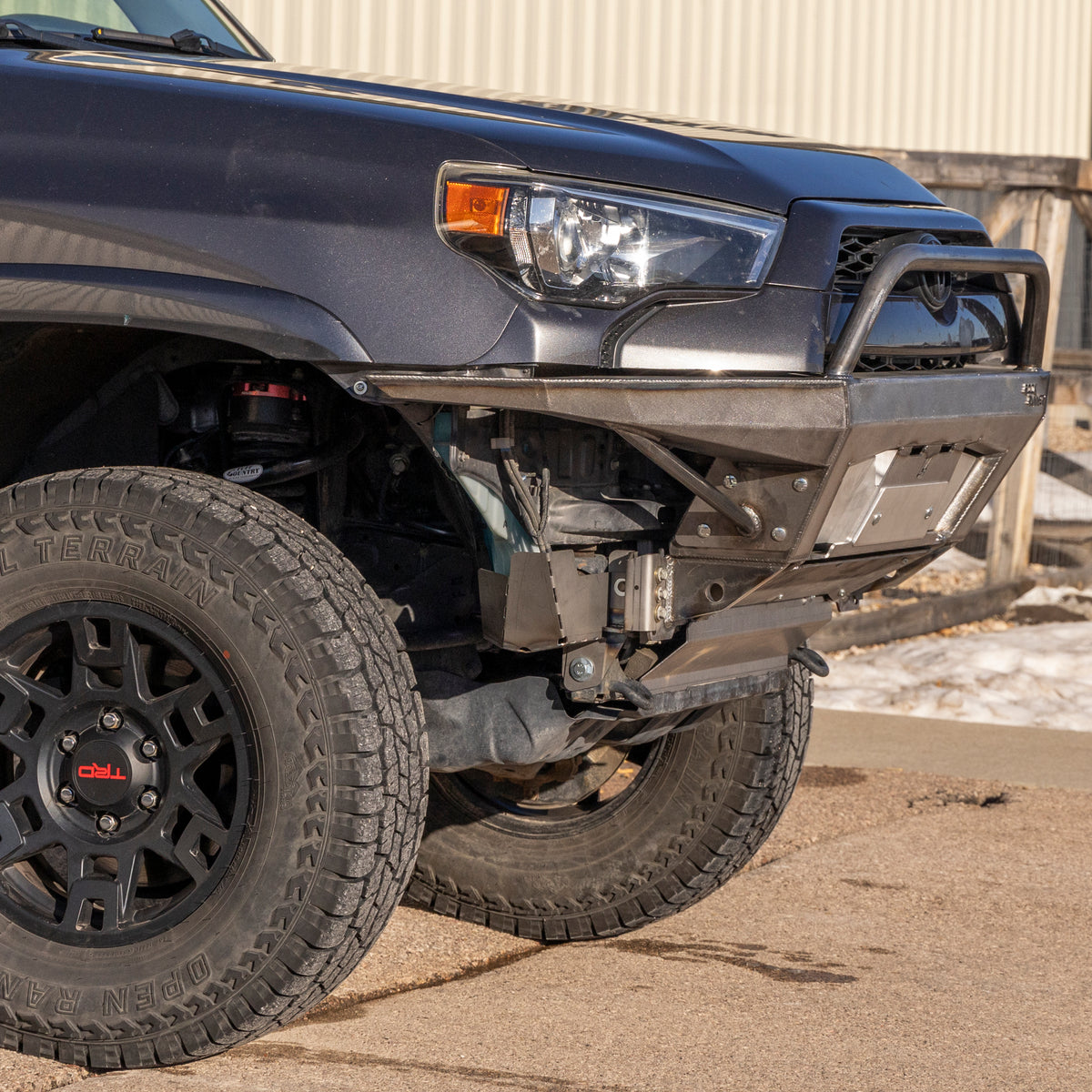 Close up view from the passenger side showing the plate sides and bull bar of the Rock Runner bumper from C4 Fabrications in Sturgis, SD.