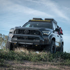 High Clearance Additions for the 6th Gen 4Runner Lo-Pro Bumper on a grassy hillside