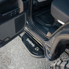 Rock sliders for the 6th Gen Toyota 4Runner viewed with the rear door open.