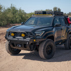 Dirt trail with our Overland Series Front Bumper for the 6th Gen 4Runner, roof rack, and exterior molle panels.