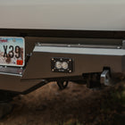 Close up showing a Baja Designs flush S2 installed in the accessory slot included on the C4 Overland rear bumper.