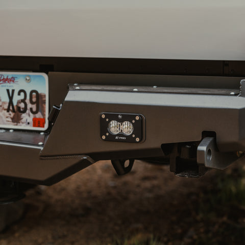 Close up showing a Baja Designs flush S2 installed in the accessory slot included on the C4 Overland rear bumper.