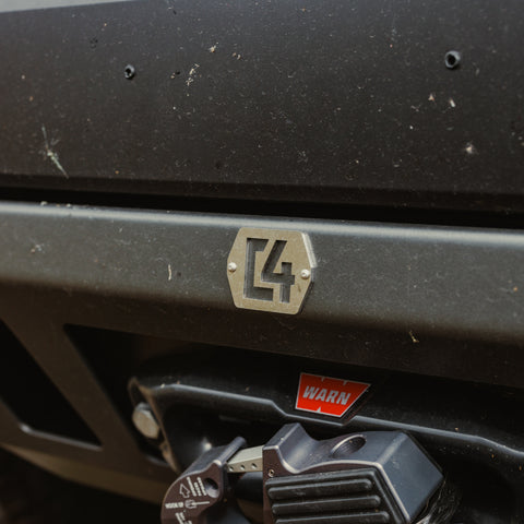 Close up of the front surface of the C4 Lo-Pro winch bumper and the C4 logo plate.