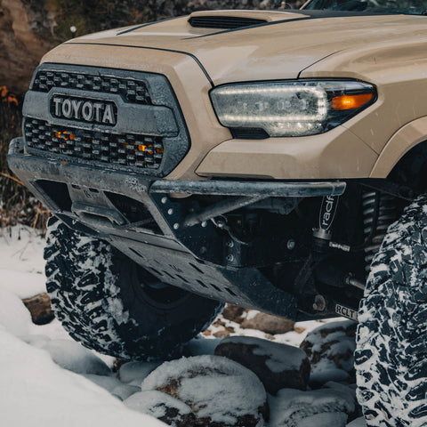 Quartering side view of the 3rd Gen Tacoma Rock Runner bumper from C4 Fabrication with the tube side option. 