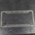 C4 License Plate Frame layed flat on a steel table to show the surface finish ready to be scuffed, polished or painted.