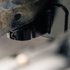 View of the C4 Body Mount Relocation kit and its weld-on frame reinforcement plate. 