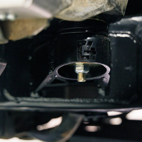 Low angle close-up showing the smaller, relocated C4 body mount included in the complete Oversized Tire Fitment Kit.