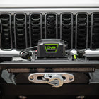 Close-up of a vehicle grille with a DV8 Offroad bumper and winch.
