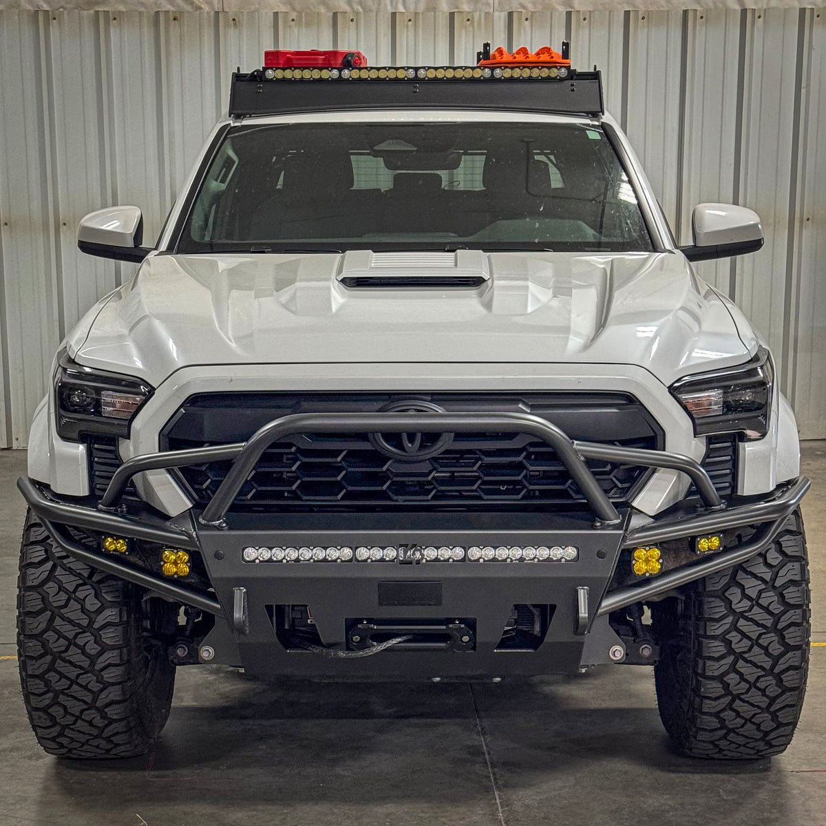 Front-on photo of the Tacoma Hybrid bumper with mid-height bull bar and tube gussets from C4 for 2024 and newer Tacomas.