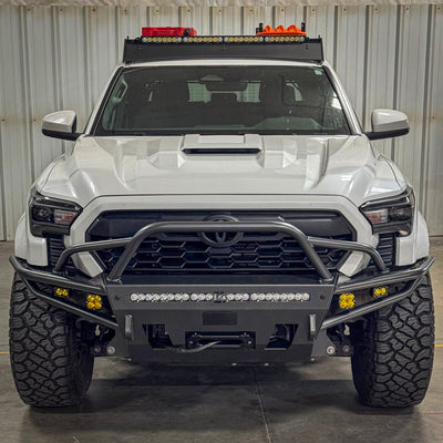 Front-on photo of the Tacoma Hybrid bumper with mid-height bull bar and tube gussets from C4 for 2024 and newer Tacomas.