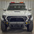 Front-on photo of the Tacoma Hybrid bumper with mid-height bull bar and tube gussets from C4 for 2024 and newer Tacomas.