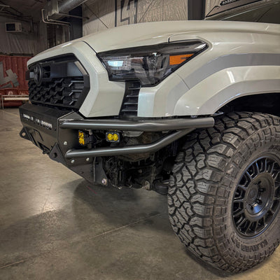 Quartering angle of the C4 Hybrid bumper for the 2024 Toyota Tacoma installed on a white truck.