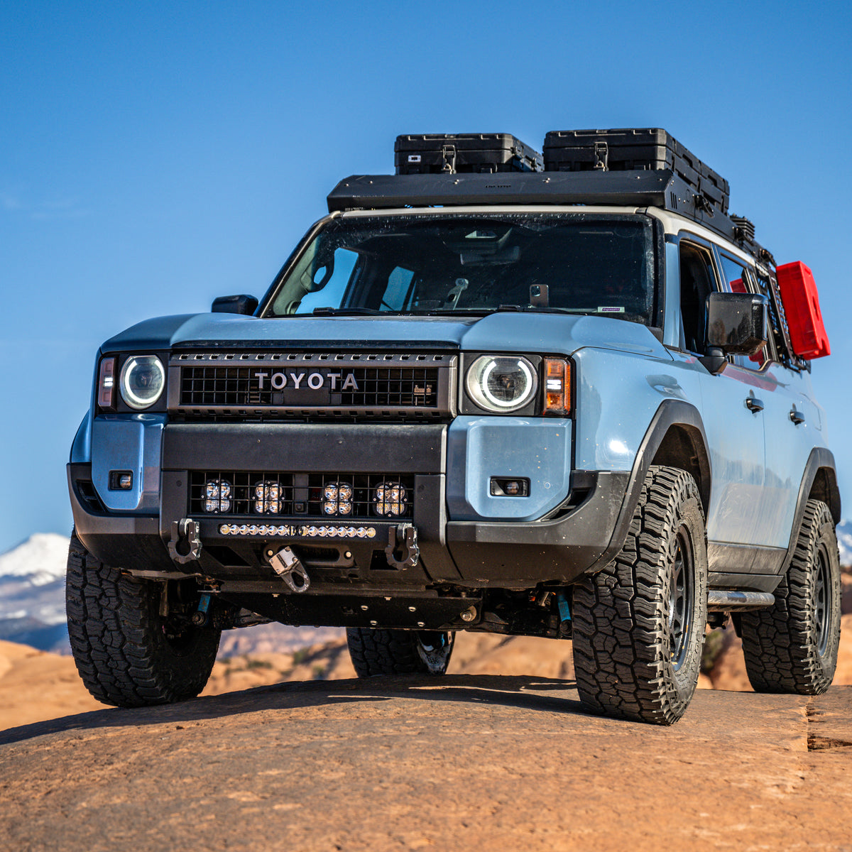 Land Cruiser LC250 sitting on a sandstone slab and showing off the C4 Lo-Pro bumper.