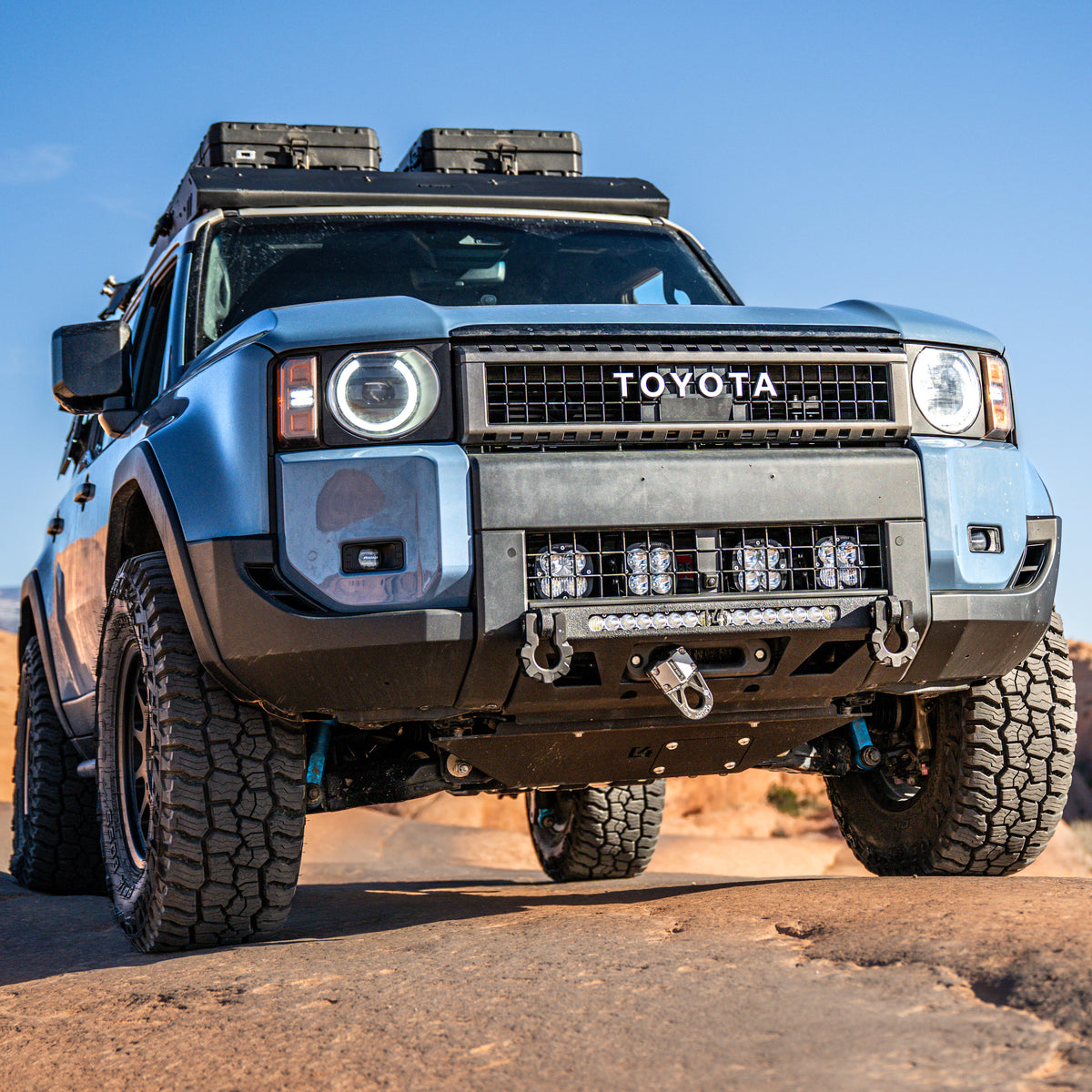 C4 Lo-Pro steel winch bumper installed into a 2024+ Land Cruiser LC250 along with winch and LED light bar.