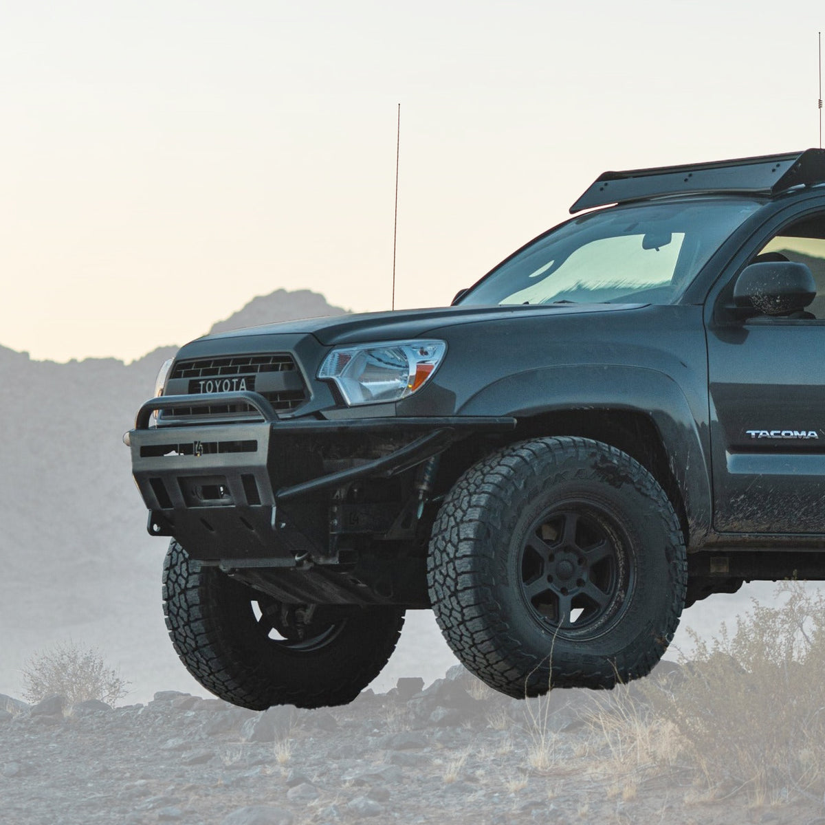 Cover photo of the C4 Hybrid front winch bumper for the late 2nd Generation Tacoma with the background faded out and the truck and bumper emphasized.