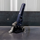 Quartering view of the C4 Fabrication rear swing latch sitting on a metal table.