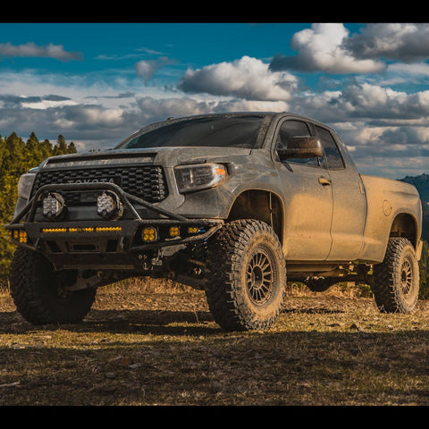 C4 Hybrid bumper installed on a lifted and wide body 2014+ Toyota Tundra Double Cab and equipped with a full array of aftermarket LED lighting. 