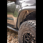 View into the back of the passenger side after installation of the C4 Oversize Tire Fitment Kit.