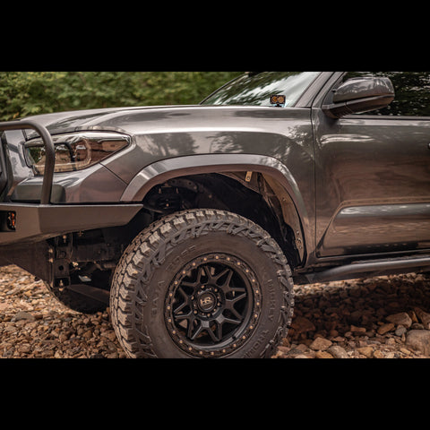 Wider view of the C4 Oversized Tire Fitment Kit installed on a 3rd Gen Tacoma.