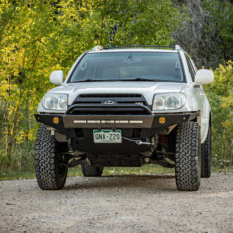 Slightly angled front view showing the C4 Overland winch bumper with low bull bar for the early 4th Generation Toyota 4Runner.