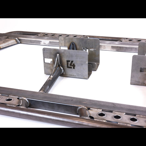 Close-up showing the bolt-on brackets for the C4 Tundra sliders.