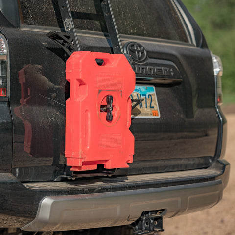 Quartering rear view of a black 4Runner with the C4 mount for RotopaX pack mount and fuel container. 