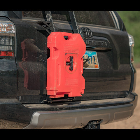 Close-up image showing a RotopaX fuel container and pack mount installed onto the C4 RotopaX mount for the Summit Hatch Ladder.
