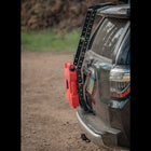 Side view of a C4 Summit hatch ladder equipped with their RotopaX mount, RotopaX pack mount and fuel container.