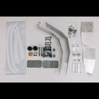 All of the contents of the Oversized Tire Fitment kit laid out on a white table.