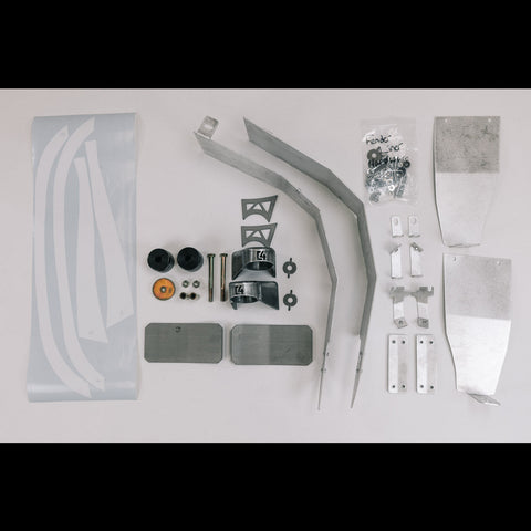 All of the contents of the Oversized Tire Fitment kit laid out on a white table.